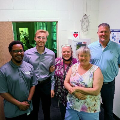 Logan Kinser and Tom Burt of ES&S with Nebraska Urban Indian Health Coalition (NUIHC) staff members.