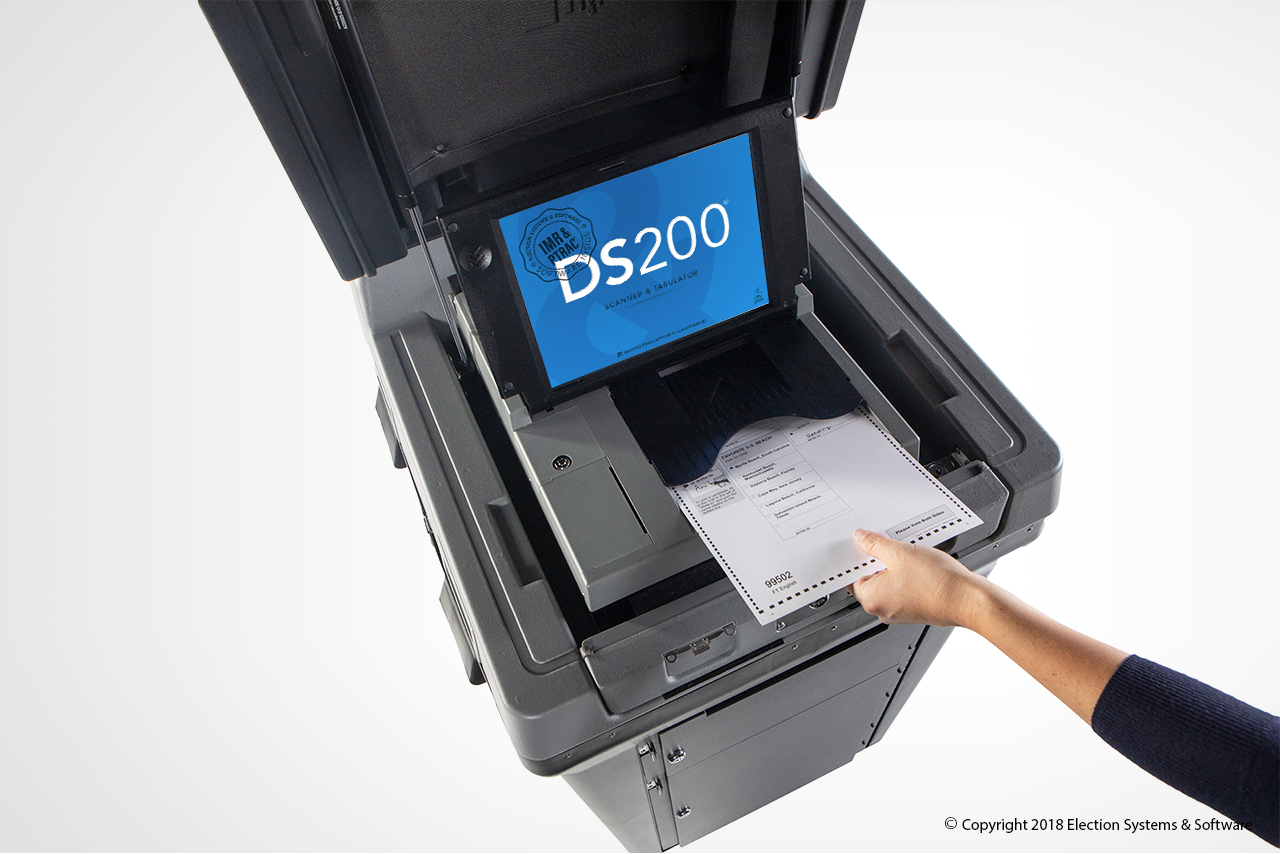 DS200 - Ballot - Hand - Angle The DS200 Is Secure Ballot Scanning And Tabulating Technology