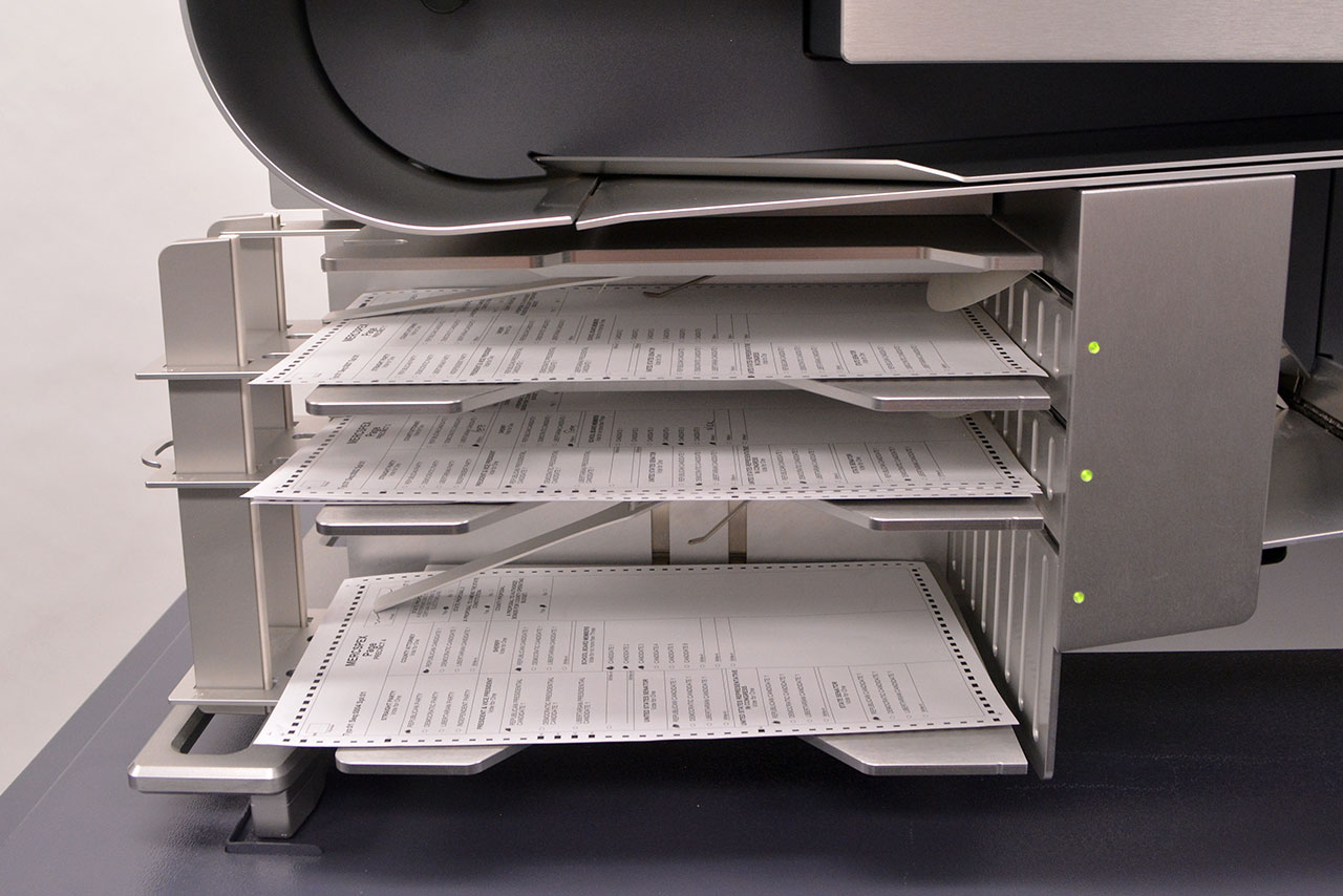 DS950 ballot output trays. No scanning interruptions for damaged ballots or ballots with exceptions. Sorts ballots into: Requires further review, Write-ins, Counted