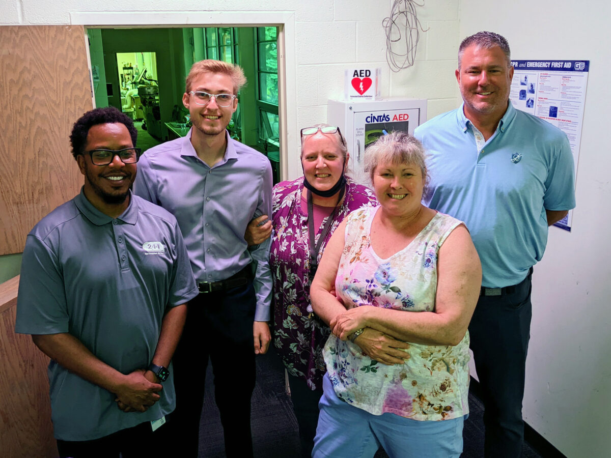 Logan Kinser and Tom Burt of ES&S with Nebraska Urban Indian Health Coalition (NUIHC) staff members.