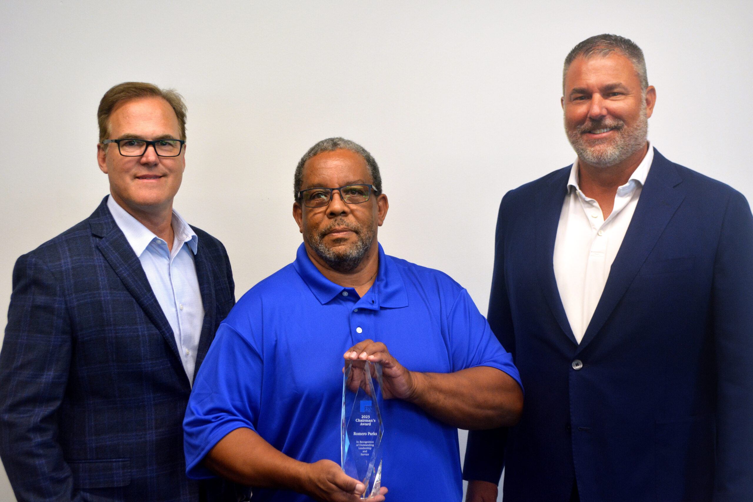 2023 Chairman's Award winner Romero Parks, with EVP & COO Jim Schmidt (left) and President & CEO Tom Burt (right)